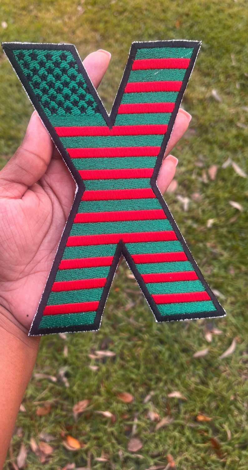 Revolutionary embroidered X