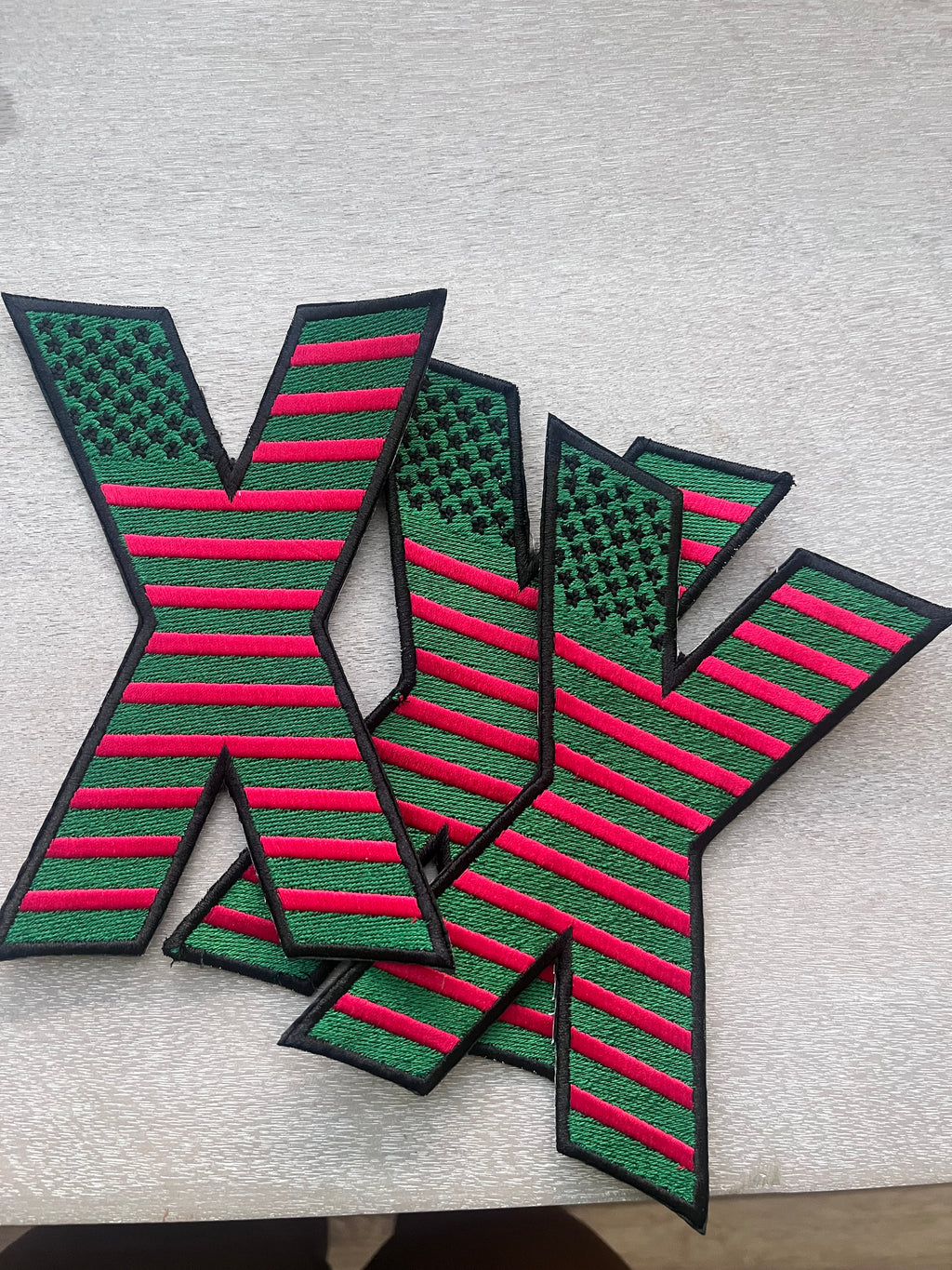 Revolutionary embroidered X